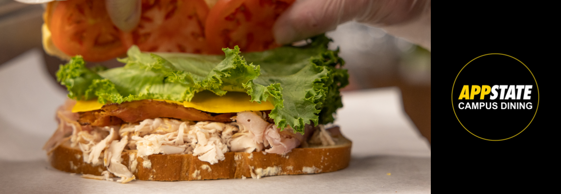 Sandwich being crafted at Carving Board in Roess Dining Hall's Sanford Commons food court