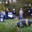 App State football in grass at tailgating event