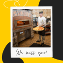 Photo of Campus Dining team member pulling a pizza out of the oven with caption