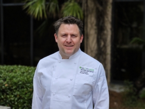 Chef John Gamradt in NACUFS chef coat at the NACUFS conference