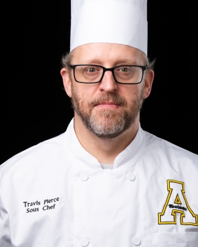 Image of Travis in Chef uniform